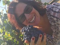 Happy with a cluster of Lizzy James Old Vine Zinfandel